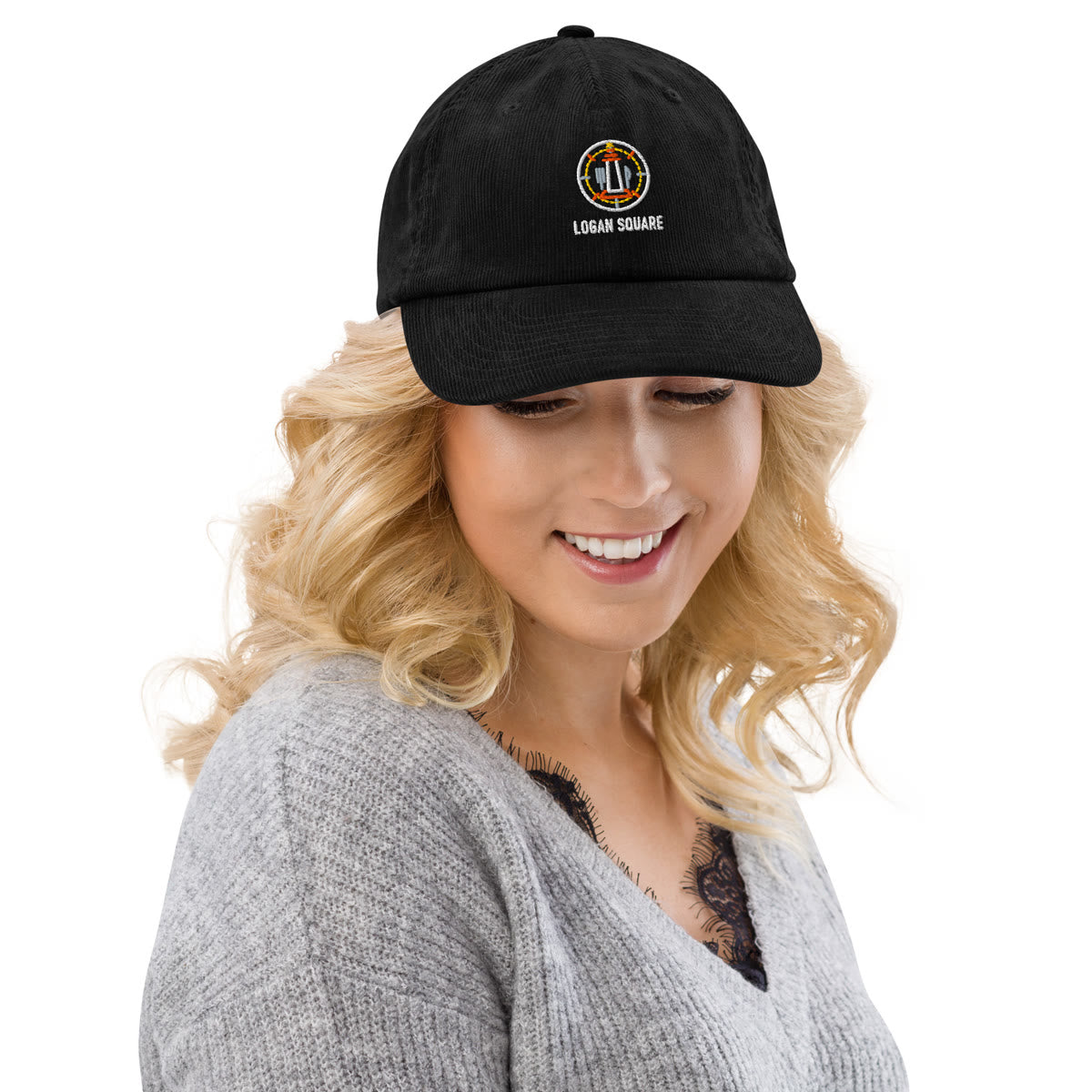 Woman wearing a Logan Square Neighborhood Series cap