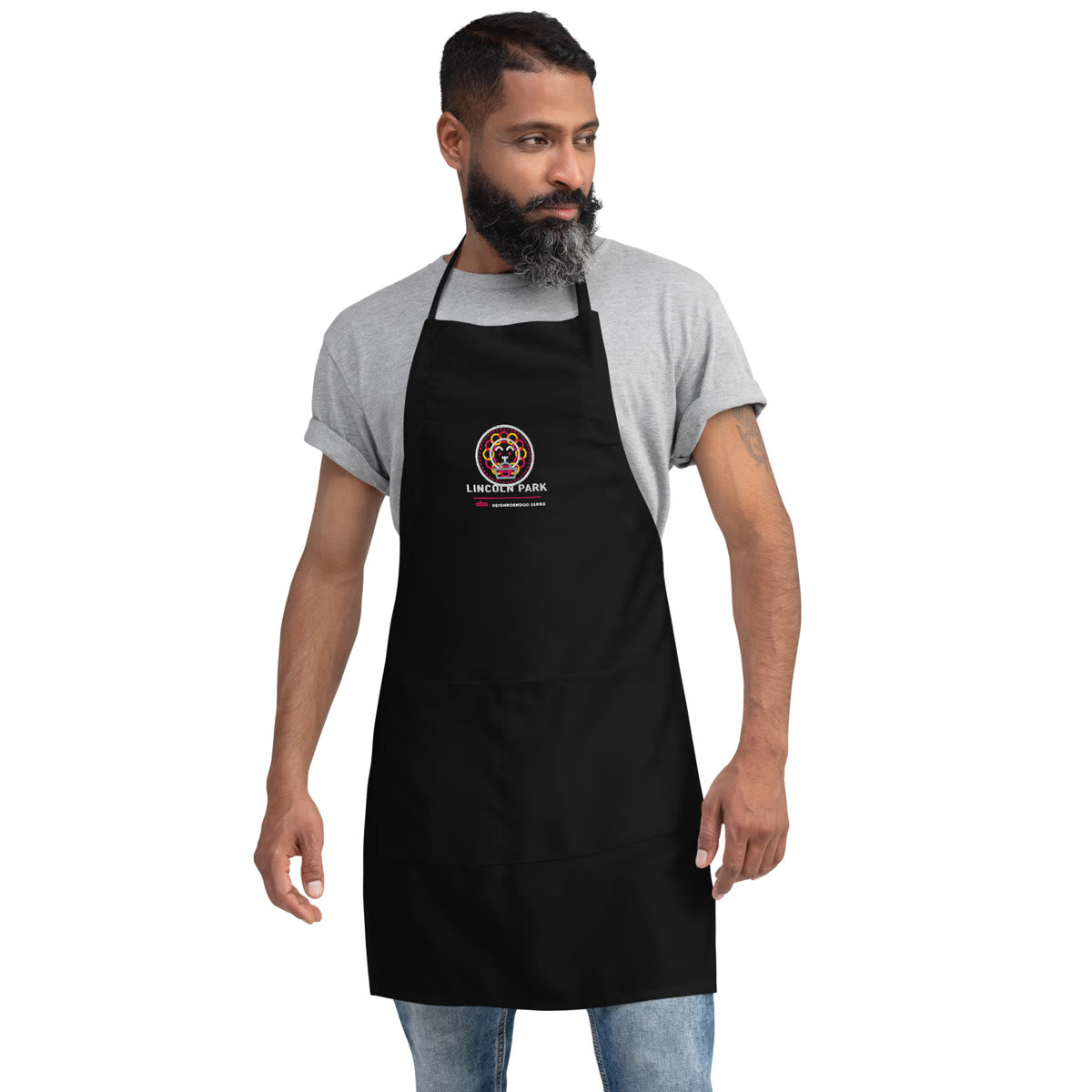 Man wearing a Lincoln Park Neighborhood Series chef apron